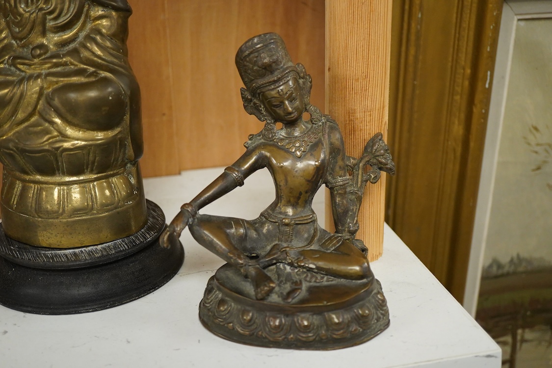 Three South East Asian brass figures to include one of Bodhisattva, largest 28cm high